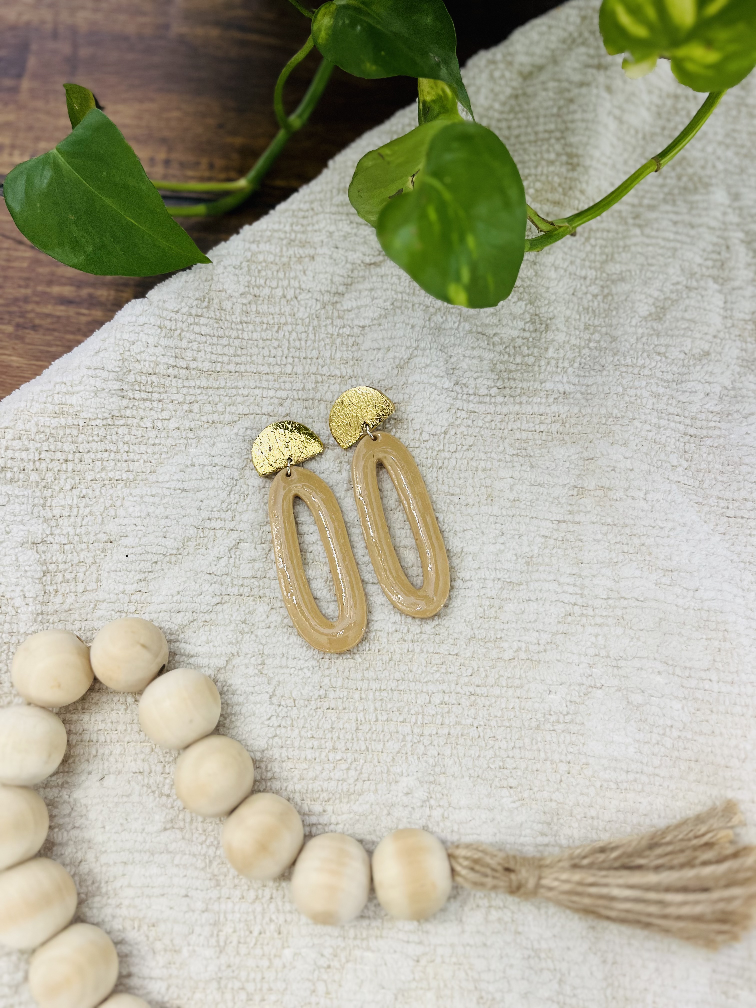 Gold and tan earrings